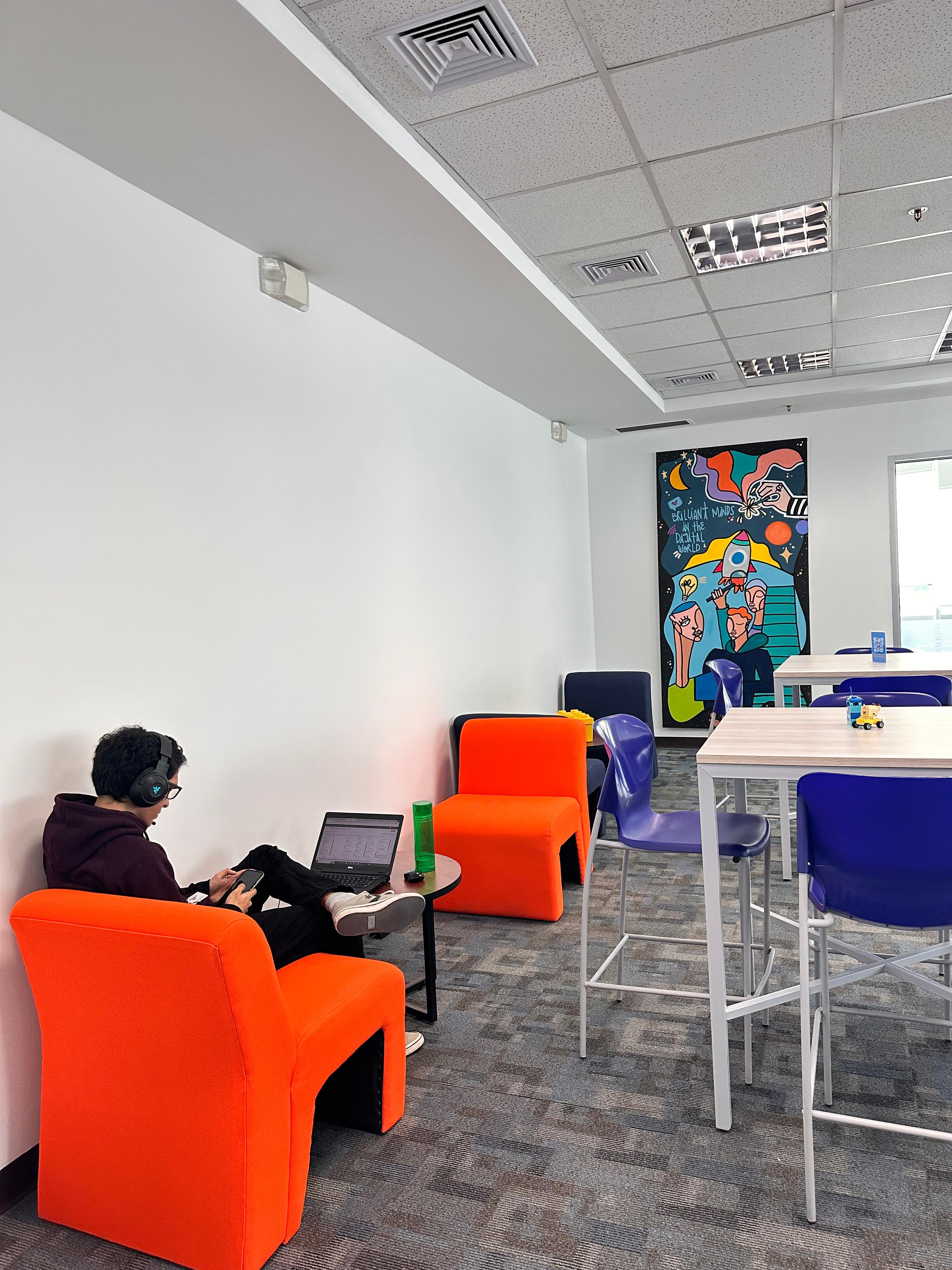 office space with lounge chairs and high tables